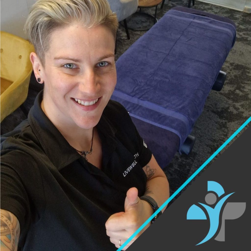 Alexandra performing massage on a couch in the Macclesfield Office